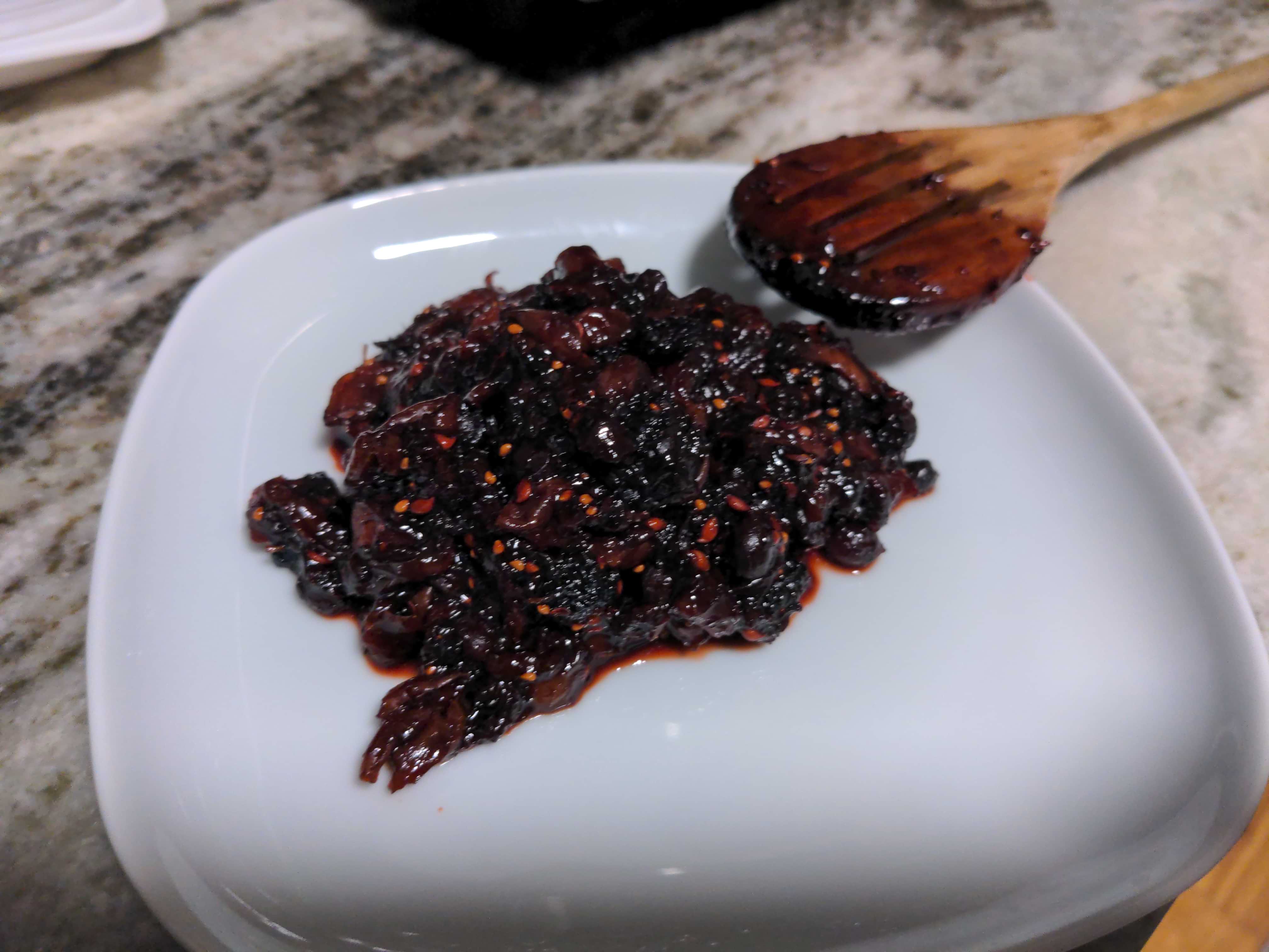 The final west philly jam in a plate containing cherries, mullberies, and juneberries.