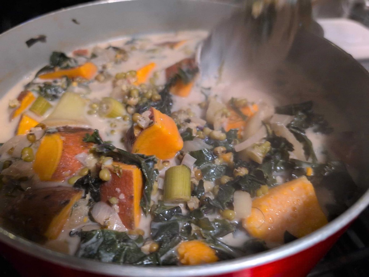 A Large Pot Of The Stew Where You Can See Mung Beans And Large Chunks Of Sweet Potatoes Swimming In Coconut Milk